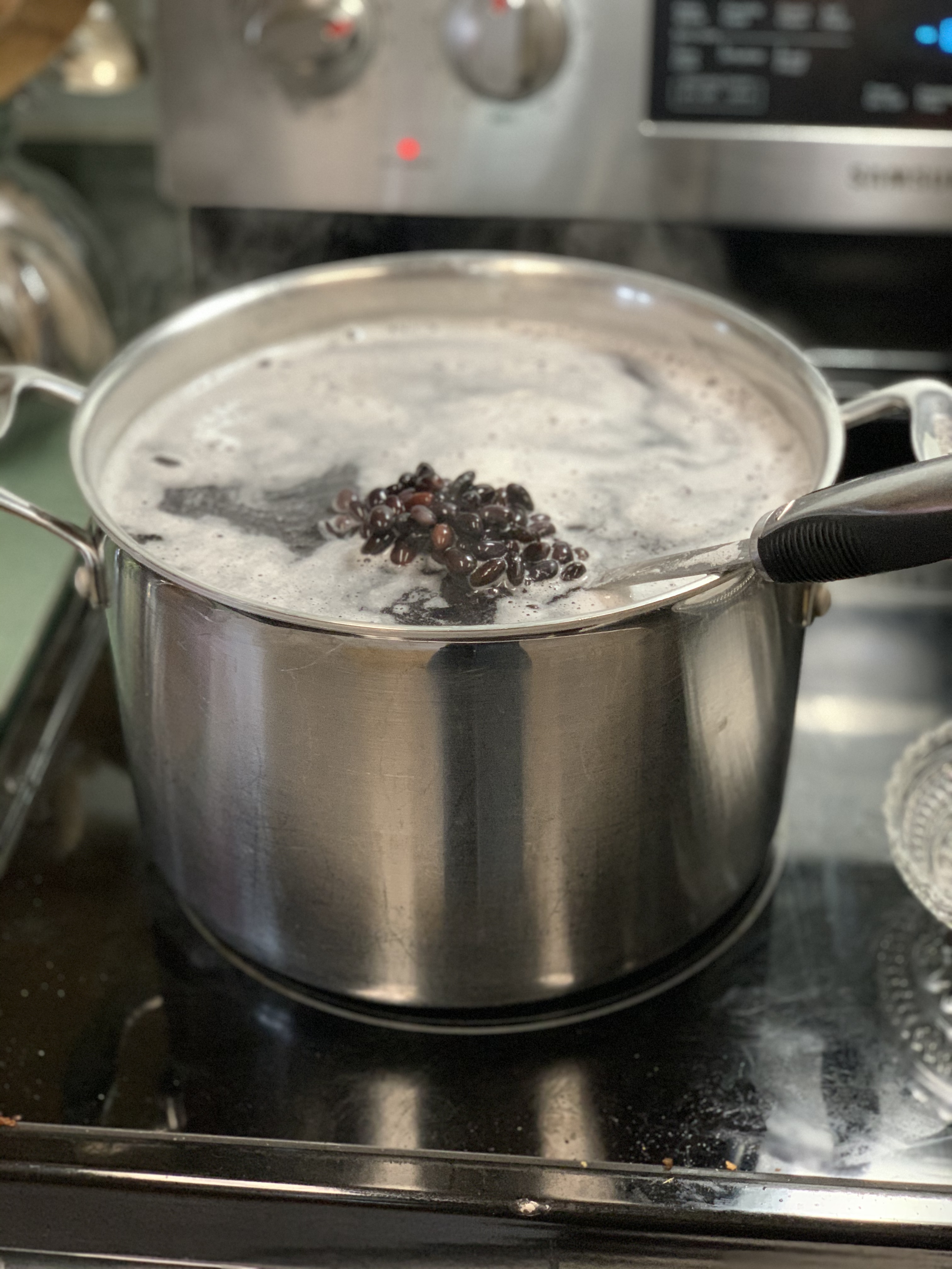 Big pot of Black beans, rinsed and heating on the stove