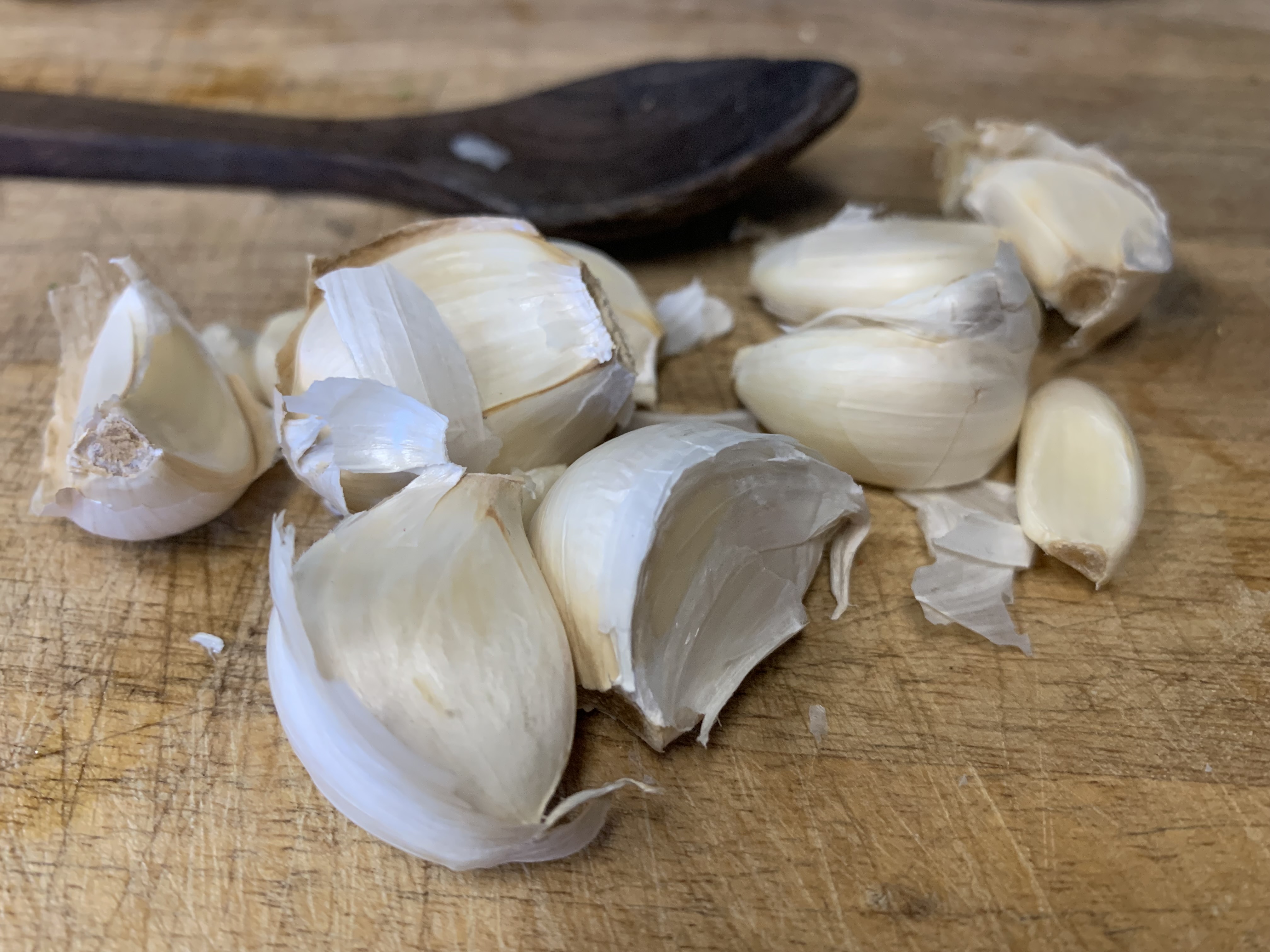 Garlic Cloves on Cutting Board ready for pealing